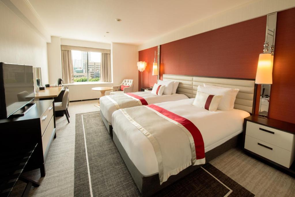 Postel nebo postele na pokoji v ubytování Tokyo Prince Hotel