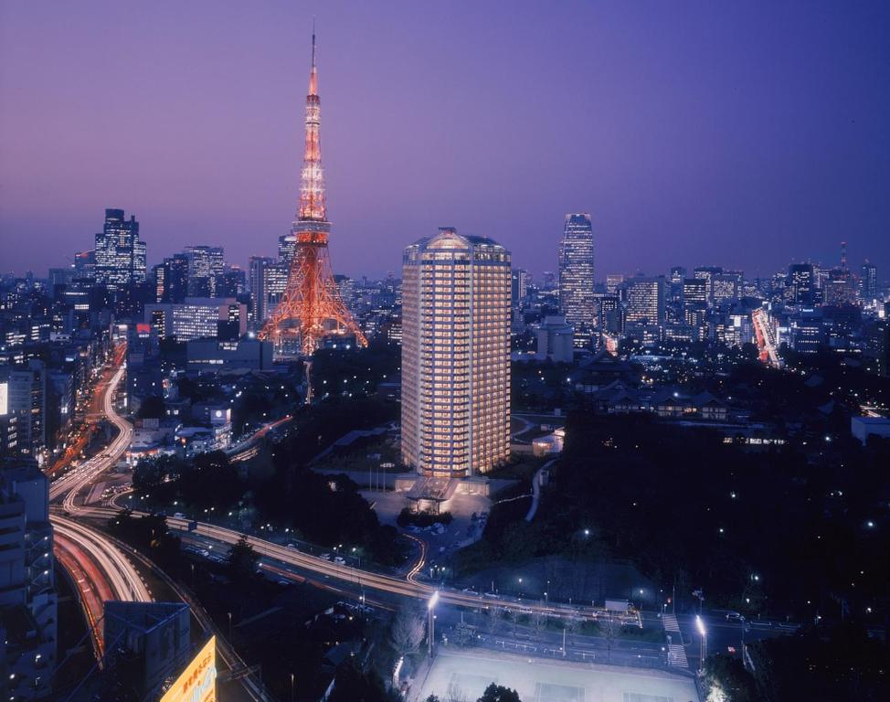 a view of a city at night with the eiffel tower at The Prince Park Tower Tokyo in Tokyo