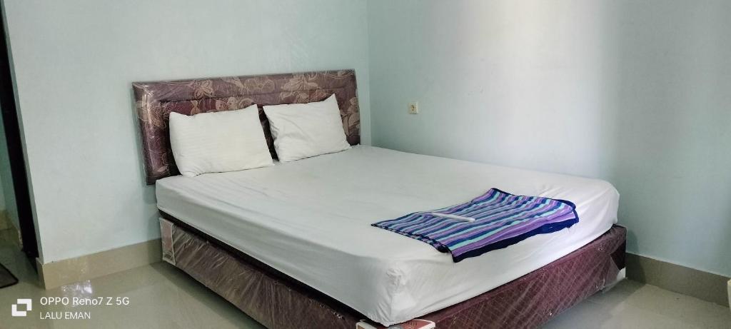 Postel nebo postele na pokoji v ubytování Suwidak Homestay