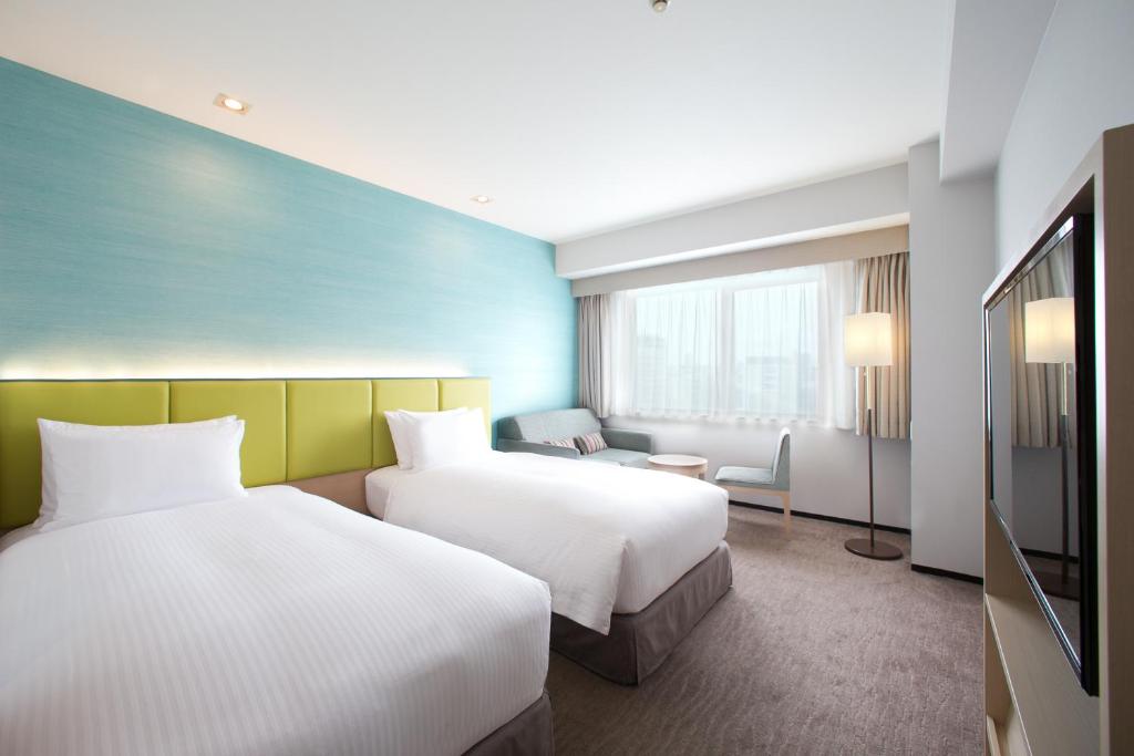 Кровать или кровати в номере Holiday Inn Osaka Namba by IHG
