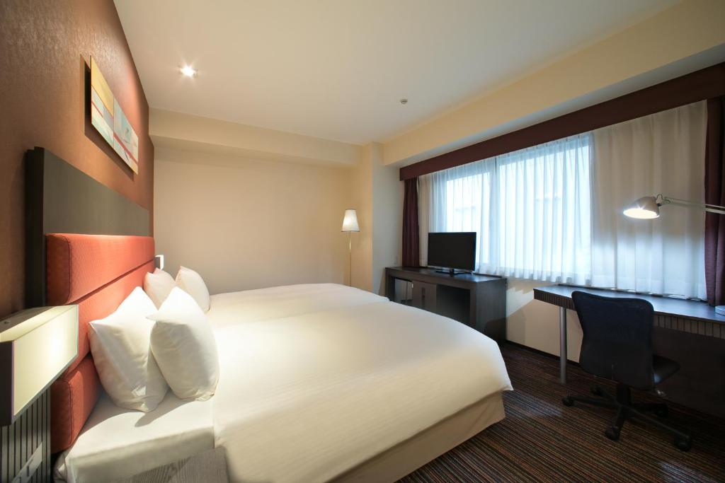 Кровать или кровати в номере Holiday Inn Osaka Namba by IHG