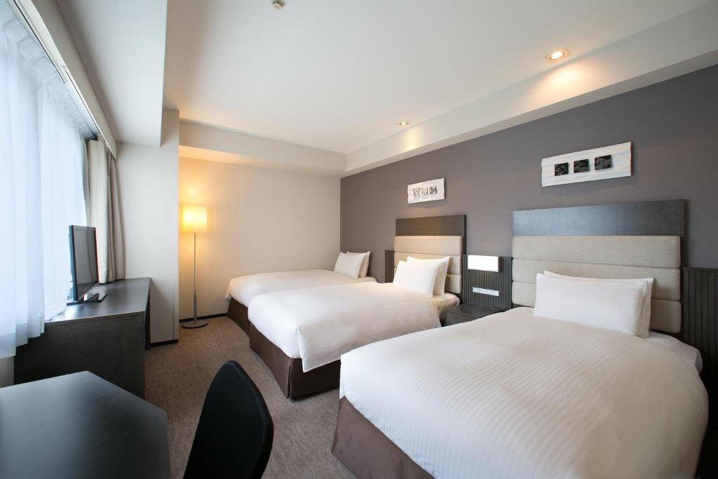 Кровать или кровати в номере Holiday Inn Osaka Namba by IHG