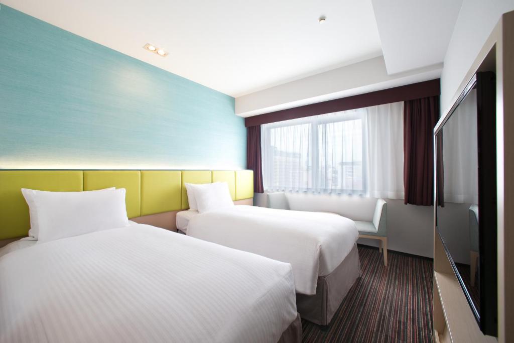 Кровать или кровати в номере Holiday Inn Osaka Namba by IHG