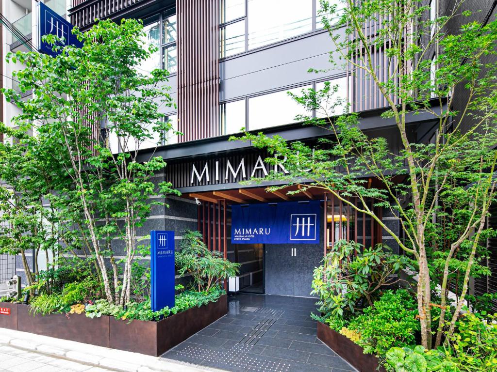 a building with a sign that reads minatomirai at MIMARU KYOTO STATION in Kyoto