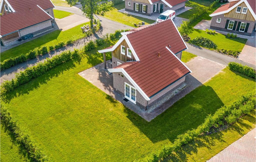 an overhead view of a house with a red roof at Buitengoed Het Lageveld - 93 in Hoge-Hexel