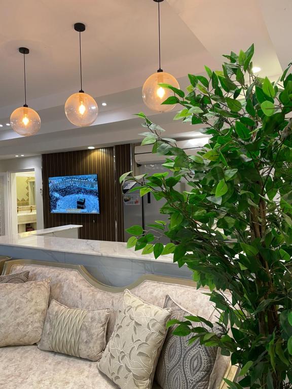 a living room with a couch and a bar at القمة العالية in Abha