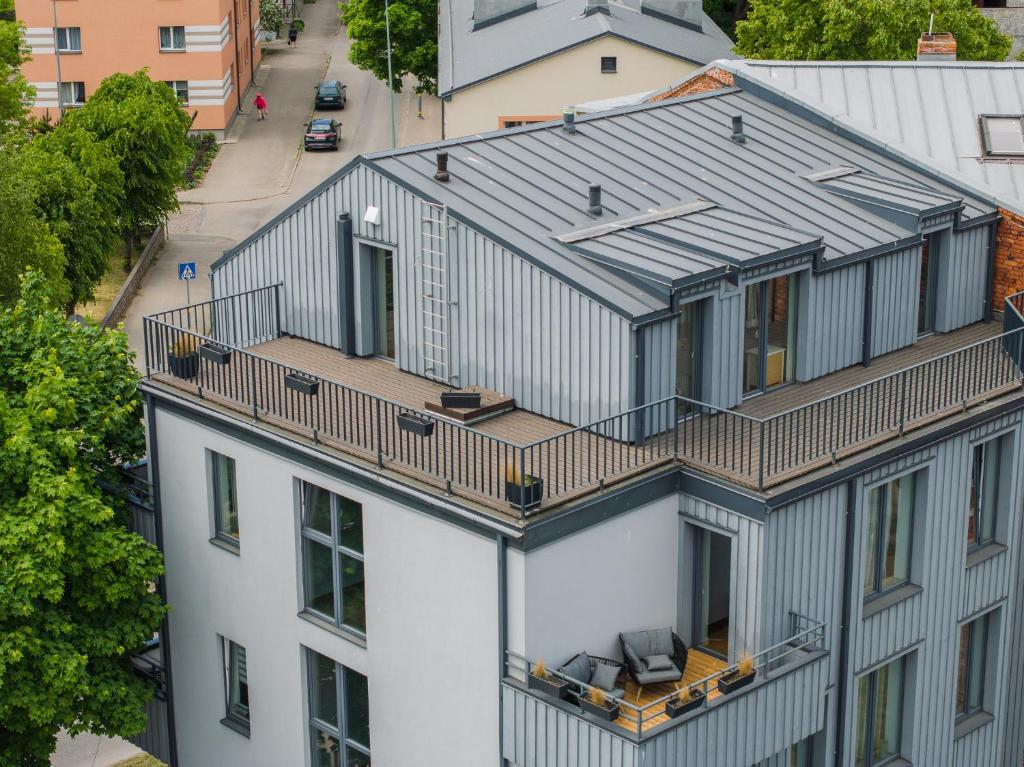 an overhead view of a building with a balcony at Luxury Three-Bedrooms Apartment in Liepāja