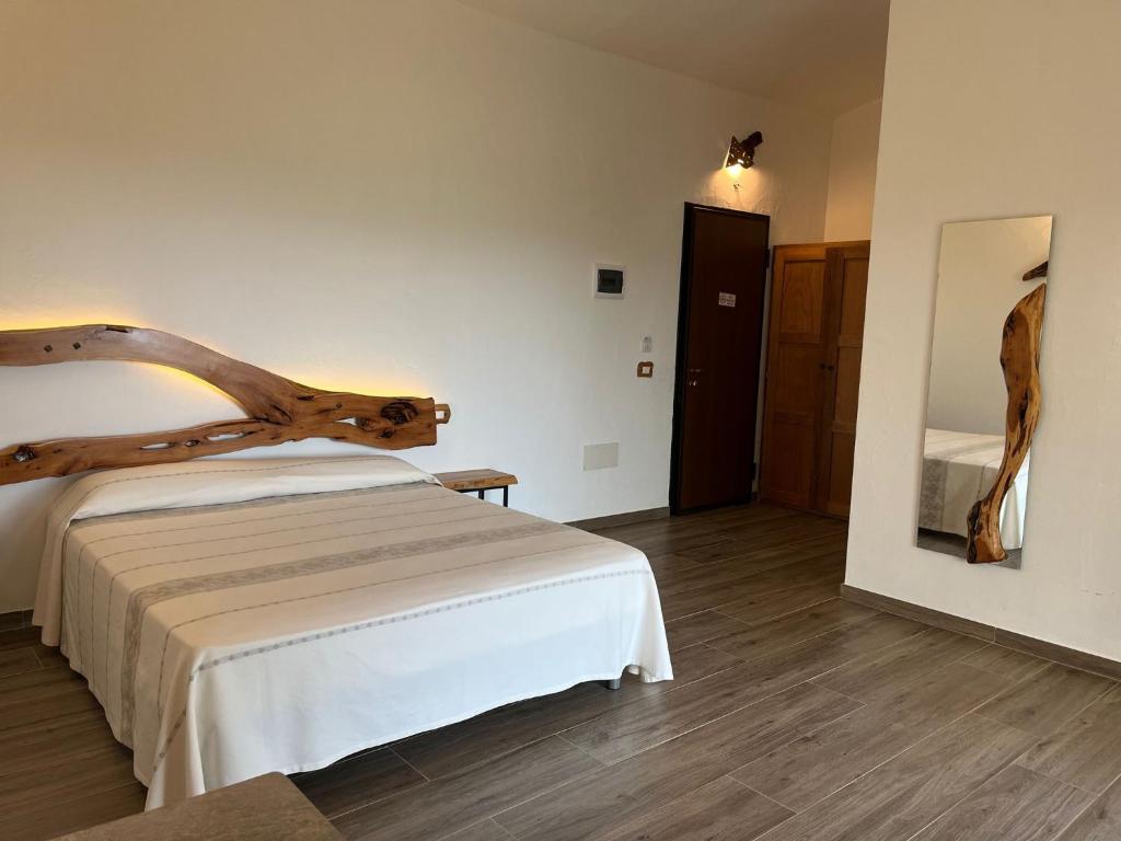 Postel nebo postele na pokoji v ubytování Turismo Rurale Lu Stazzu Arzachena