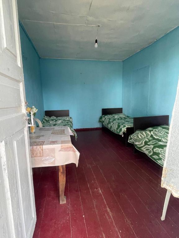 Postel nebo postele na pokoji v ubytování Guesthouse ''Loni''