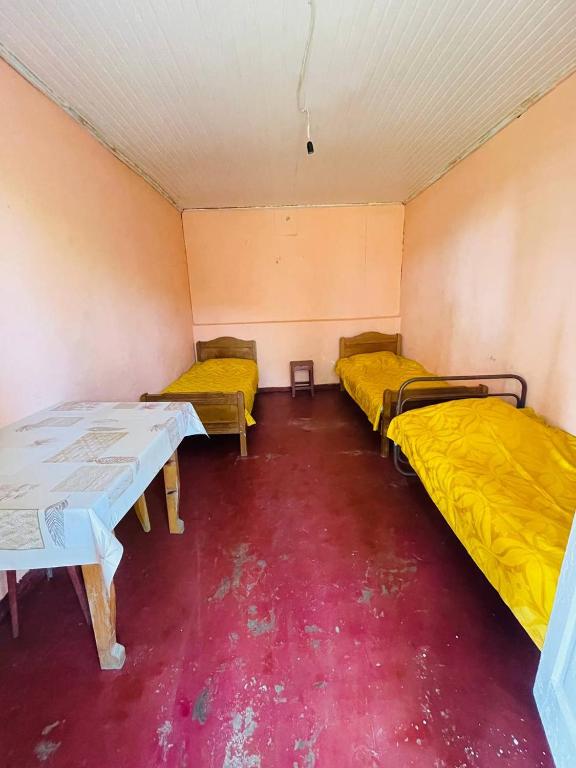 Postel nebo postele na pokoji v ubytování Guesthouse ''Loni''