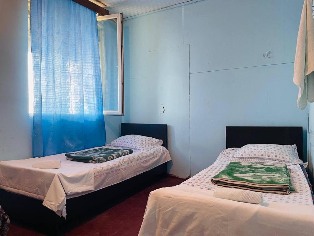 Postel nebo postele na pokoji v ubytování Guesthouse ''Loni''