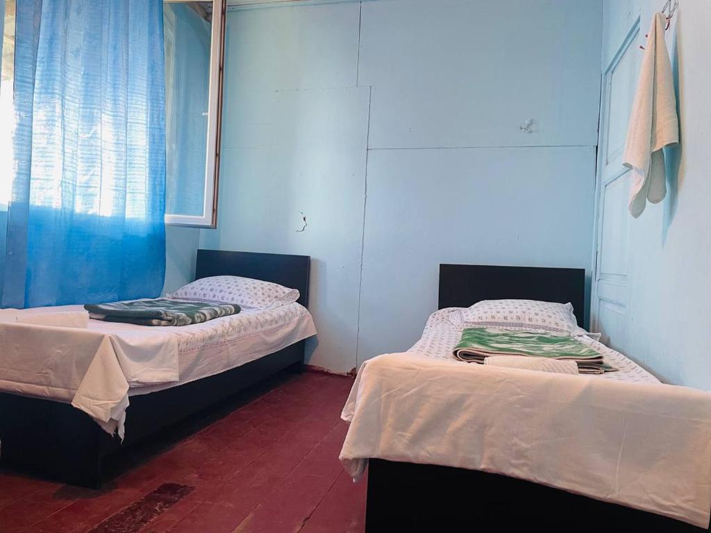 Postel nebo postele na pokoji v ubytování Guesthouse ''Loni''