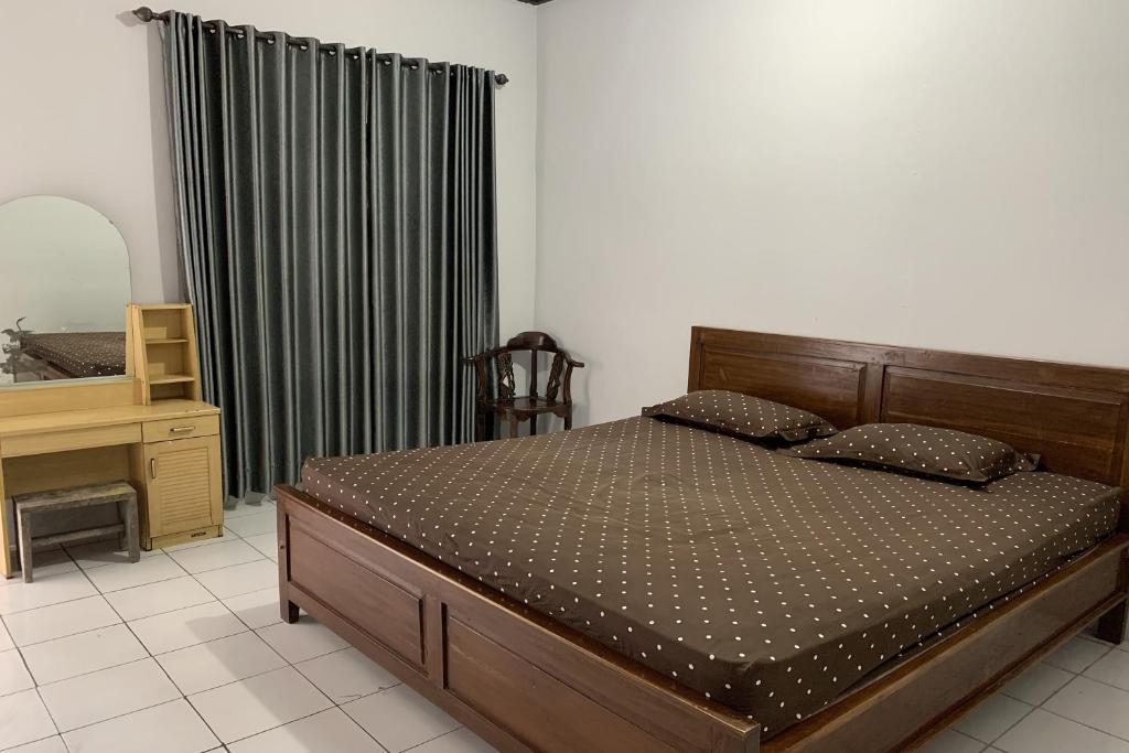 Postel nebo postele na pokoji v ubytování Hotel Merak Indah