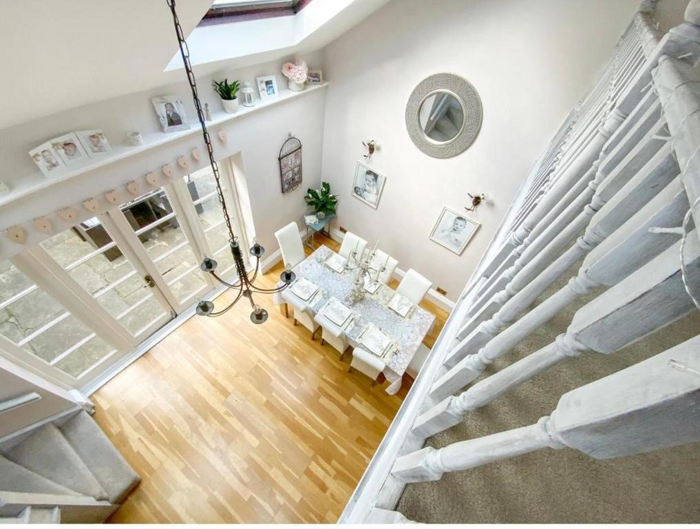 an overhead view of a living room with a staircase at A Hidden Gem in Burnham