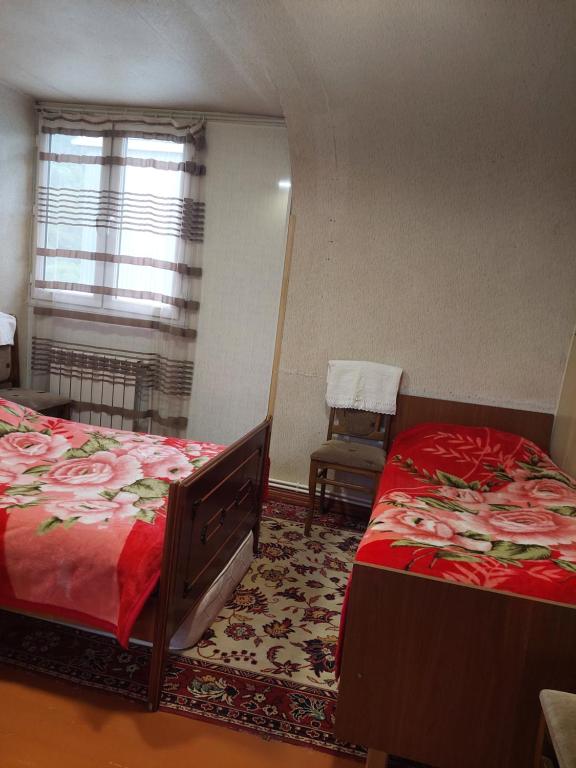 Postel nebo postele na pokoji v ubytování Arman Guest House