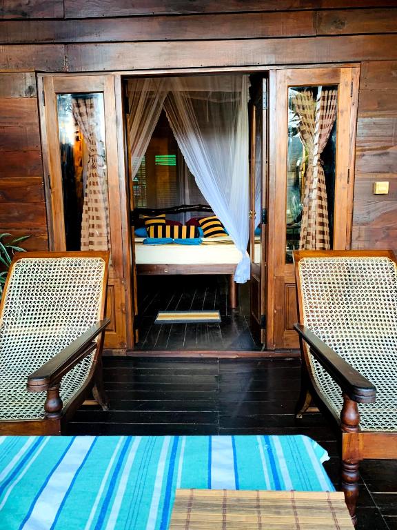 Postel nebo postele na pokoji v ubytování Madushanka Resort