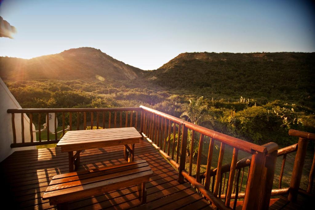 a wooden deck with a picnic table on top of a mountain at Nukakamma Guest House in Colchester