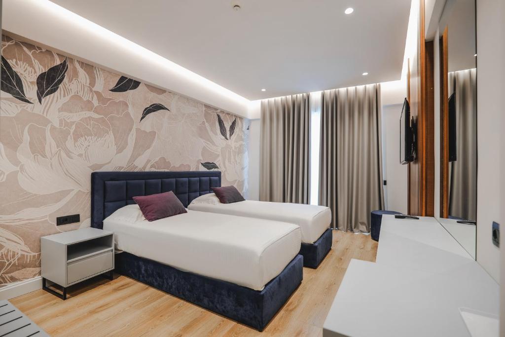 Postel nebo postele na pokoji v ubytování Hotel Oasis