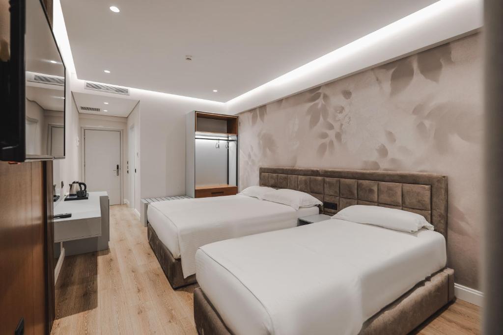 Postel nebo postele na pokoji v ubytování Hotel Oasis