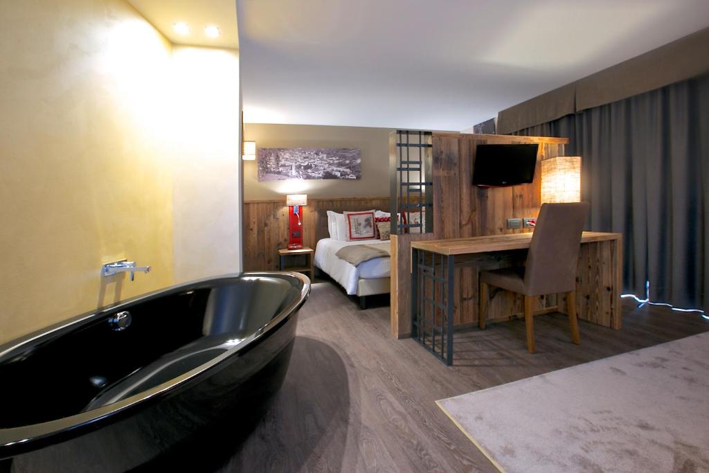 Postel nebo postele na pokoji v ubytování Olimpia Hotel