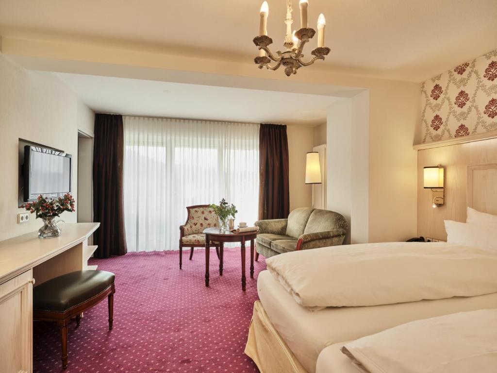 Postel nebo postele na pokoji v ubytování Hotel Reppert