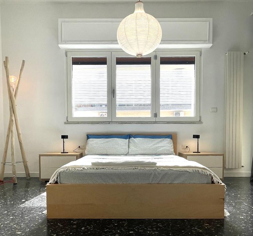 Ένα ή περισσότερα κρεβάτια σε δωμάτιο στο EASYSTAY BARI Rooms