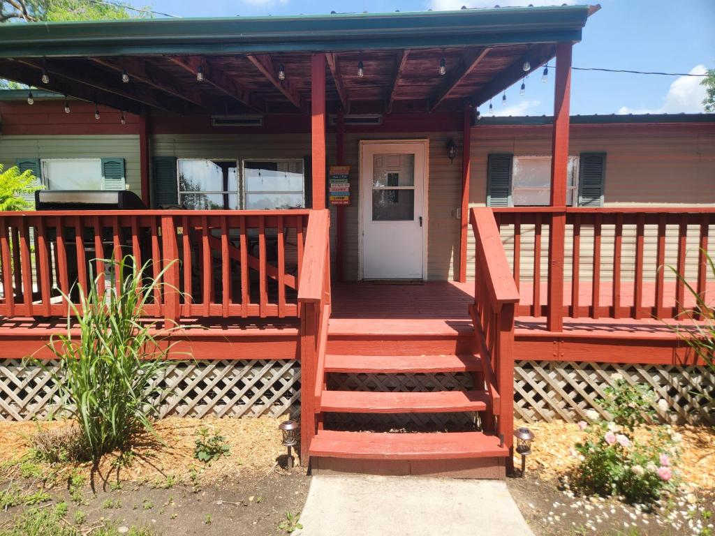 a front porch of a home with a wooden deck at Quiet Cozy Cottonwood Cottage in Scotia in Scotia