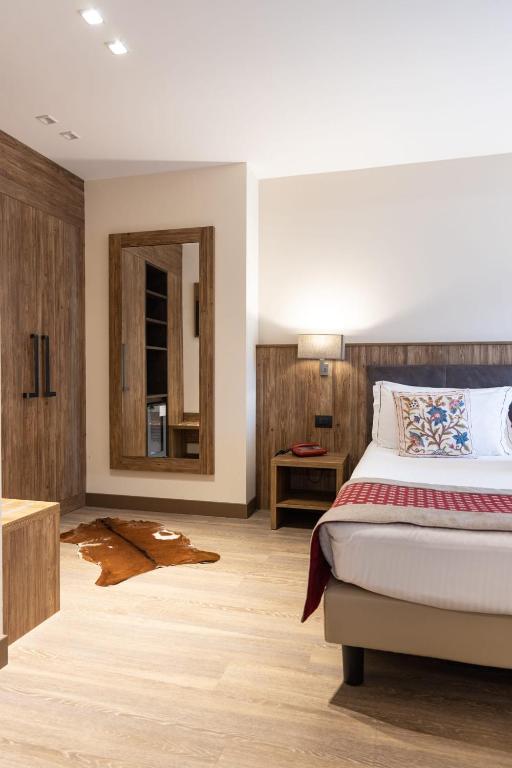 Postel nebo postele na pokoji v ubytování Olimpia Hotel