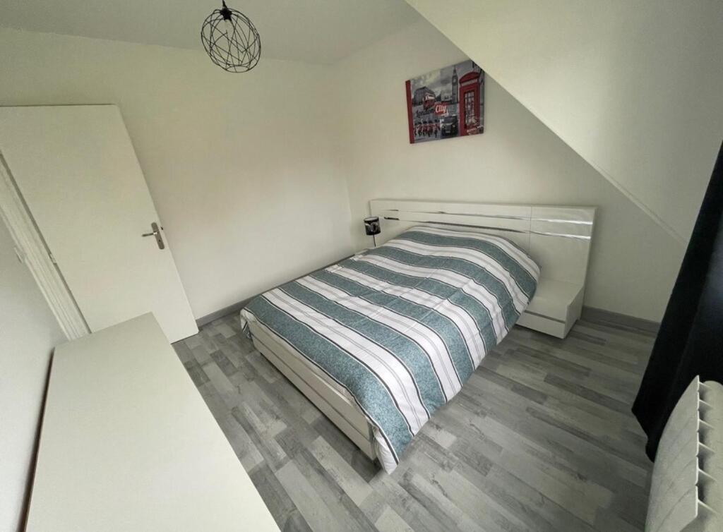 Ein Bett oder Betten in einem Zimmer der Unterkunft G&icirc;te Le Rhodo