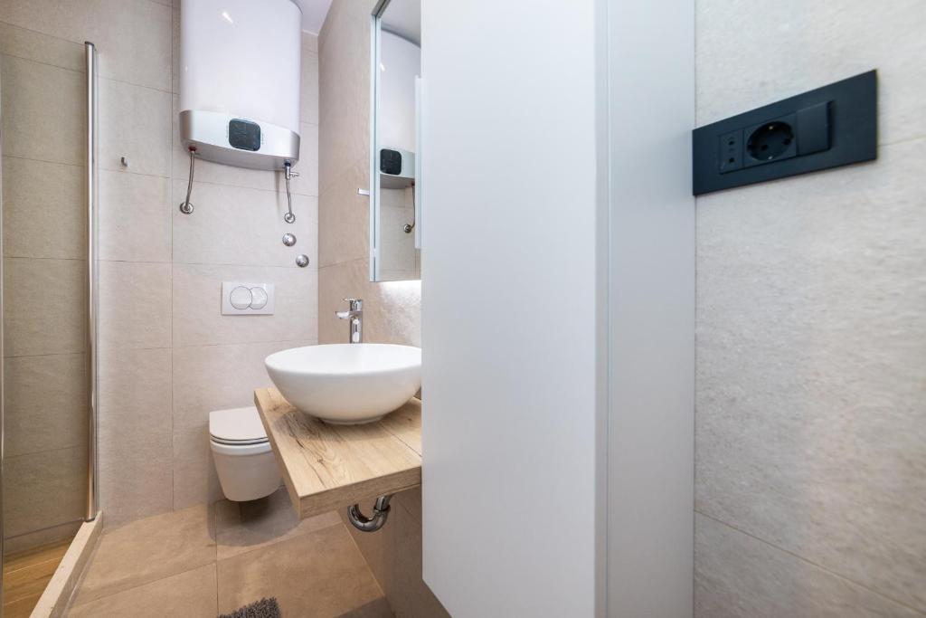 Koupelna v ubytování Apartments Ema