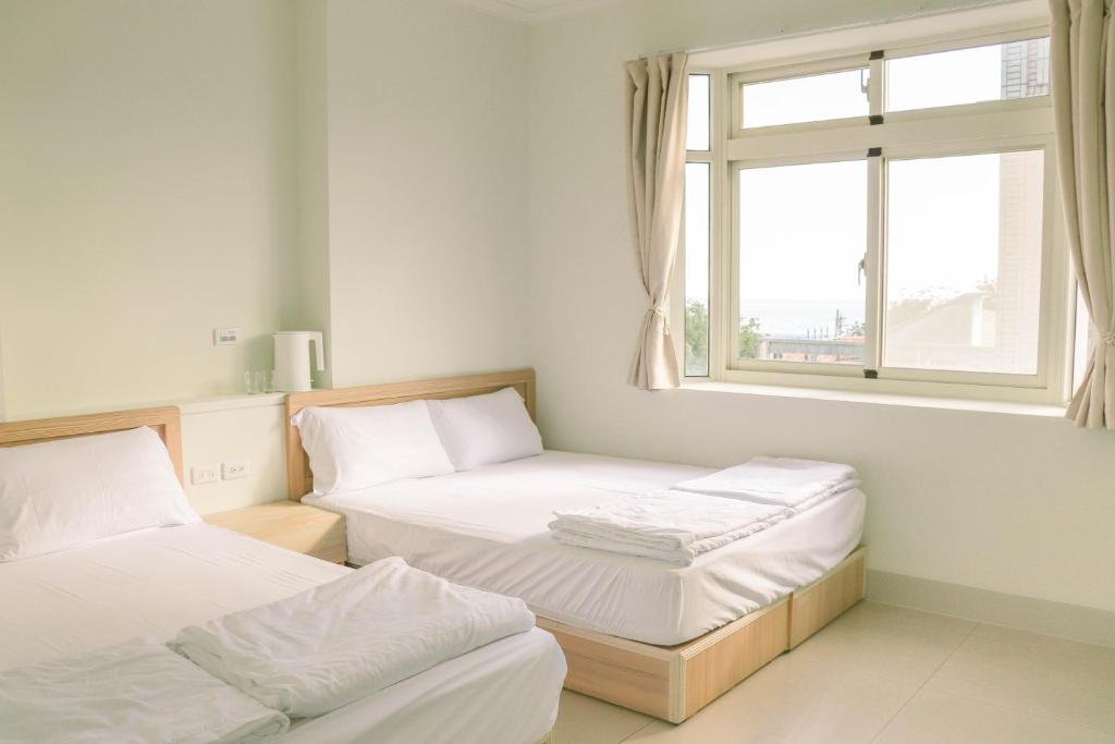 Posteľ alebo postele v izbe v ubytovaní TETE Homestay