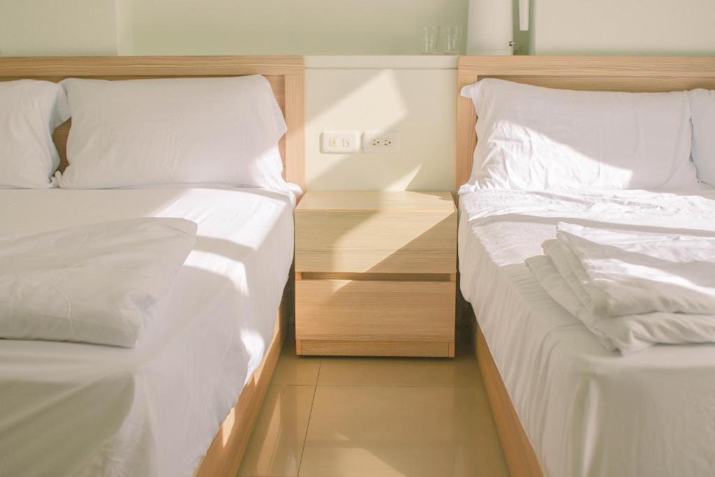 Postel nebo postele na pokoji v ubytování TETE Homestay