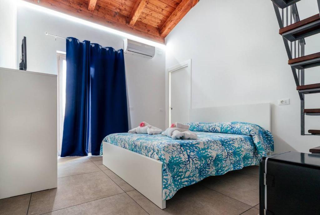 Postel nebo postele na pokoji v ubytování Residenza Anna Calabria