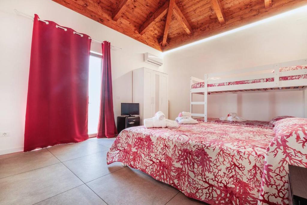 Postel nebo postele na pokoji v ubytování Residenza Anna Calabria