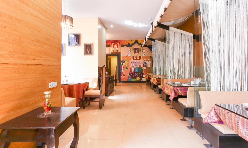 Posezení v ubytování Treebo Regency - Bund Garden, Dhole Patil Road