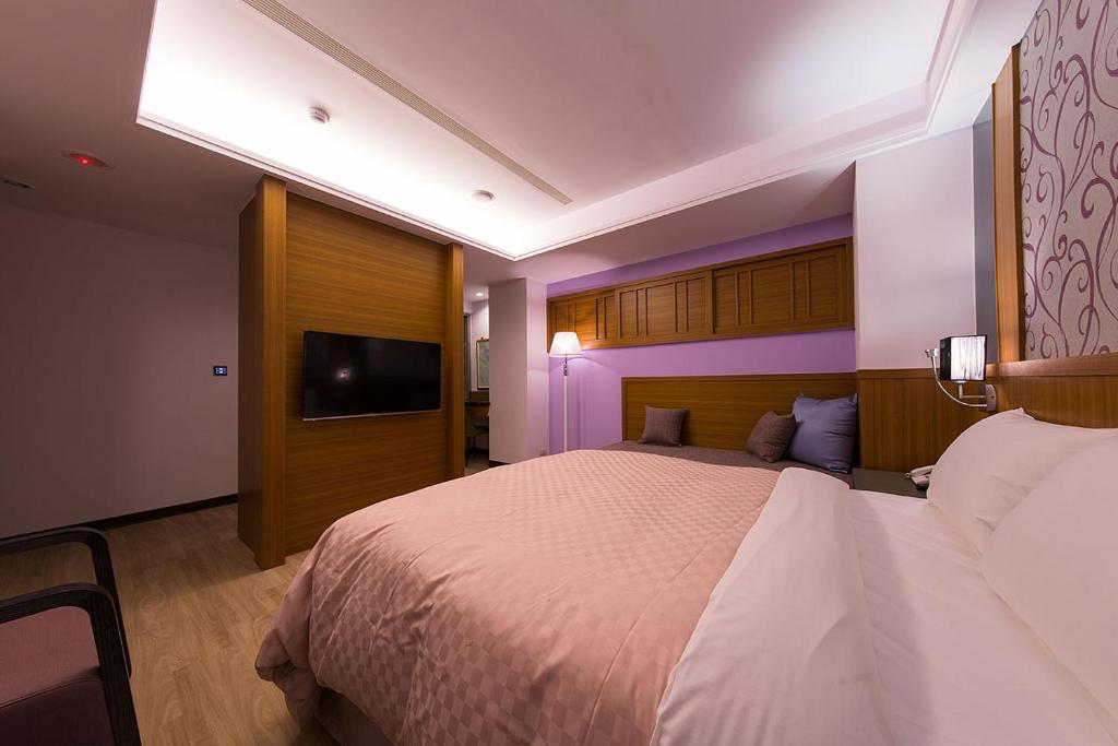 Postel nebo postele na pokoji v ubytování Sir Motel - Sanchong