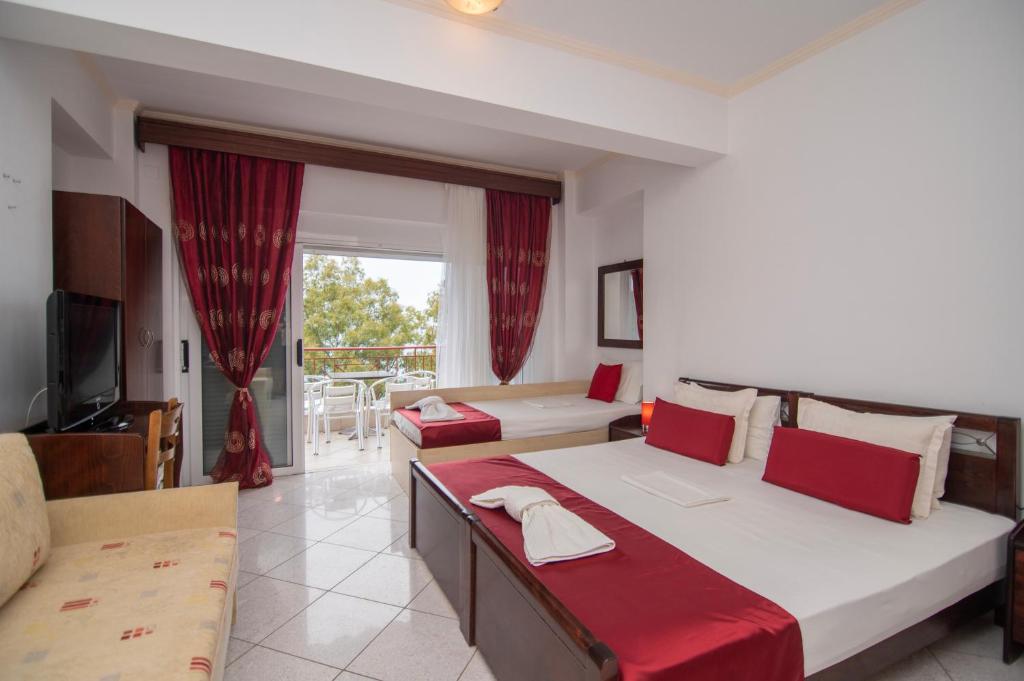 Postel nebo postele na pokoji v ubytování hotelsunnybeachgr
