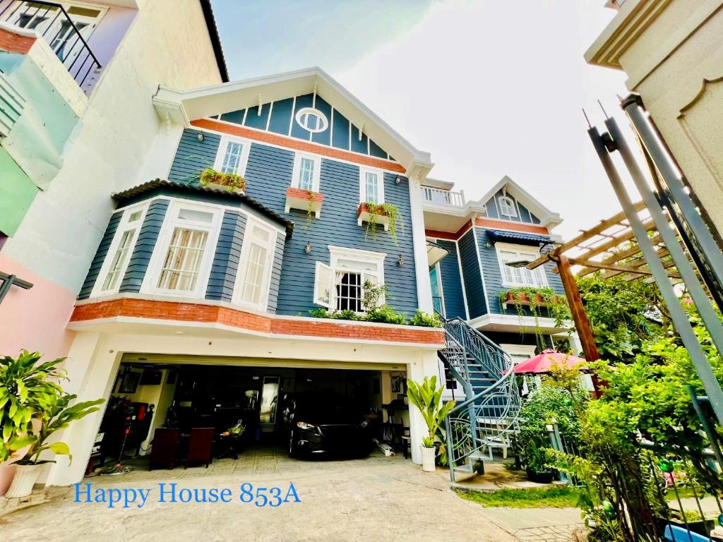 a blue house with a happy house at Căn Funny in Vung Tau