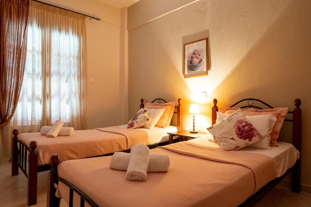 Postel nebo postele na pokoji v ubytování Effie Rooms