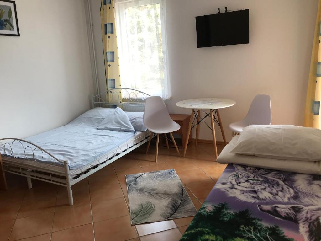 Postel nebo postele na pokoji v ubytování Dom Jana