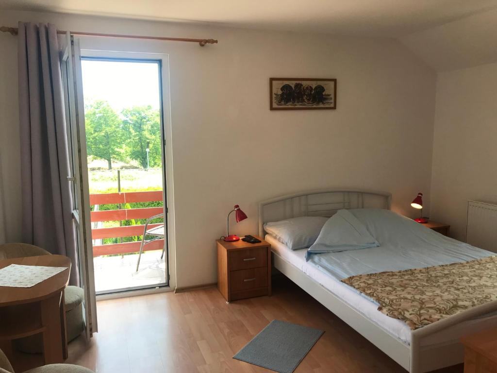 Postel nebo postele na pokoji v ubytování Dom Jana