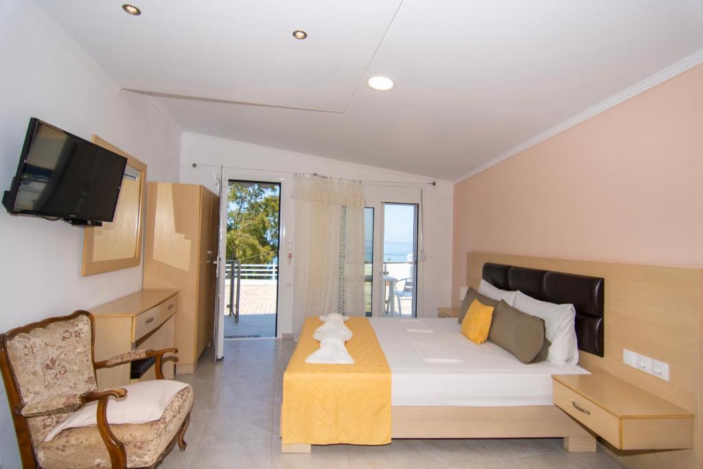 Postel nebo postele na pokoji v ubytování hotelsunnybeachgr
