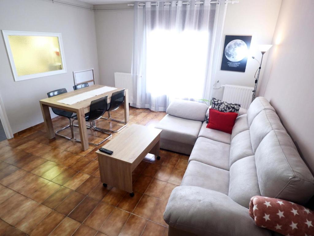 a living room with a couch and a table at E22164 Sant Ramon in Sant Feliu de Guíxols