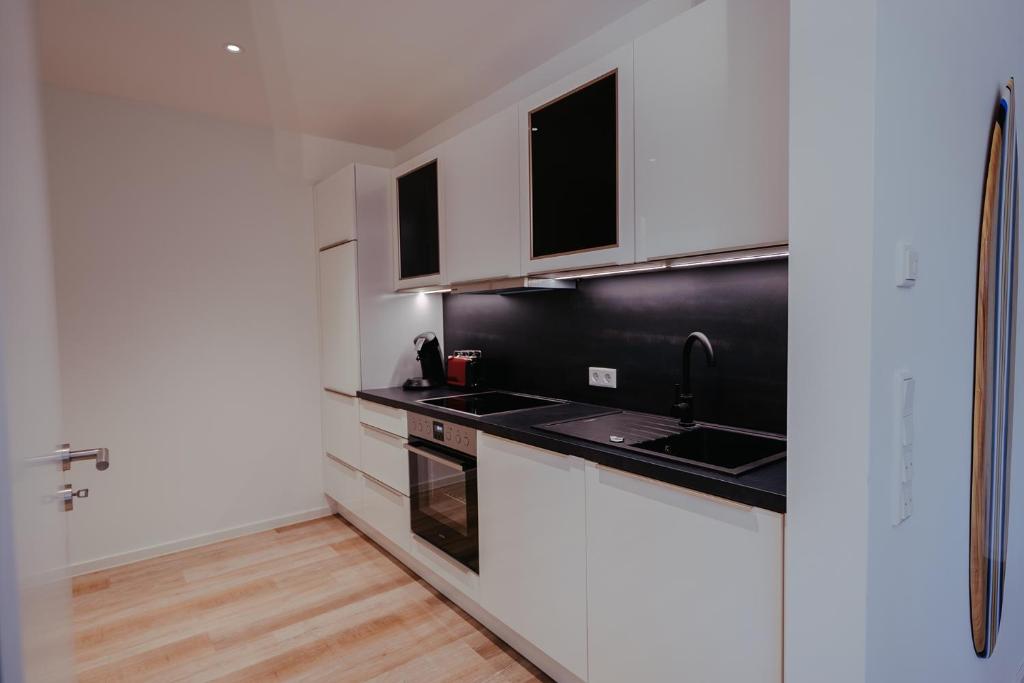 Kuchyň nebo kuchyňský kout v ubytování Ferienapartments Seepark Möhnesee