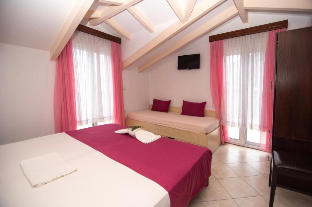 Postel nebo postele na pokoji v ubytování hotelsunnybeachgr