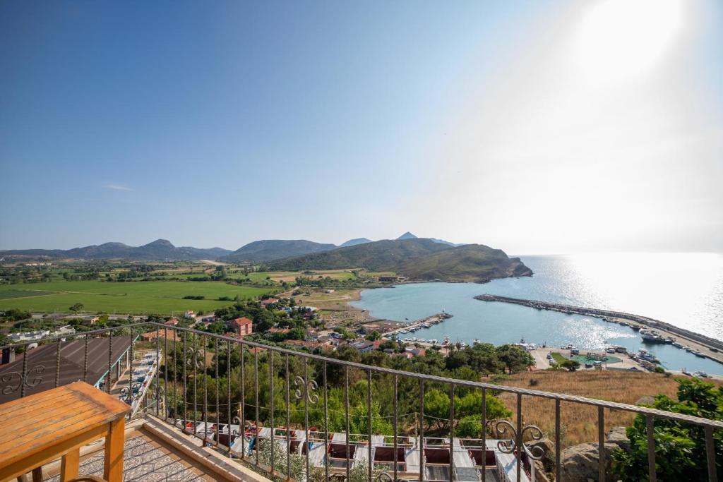 a view of the ocean from the balcony of a resort at Yakamoz Hotel Gökçeada in Gokceada Town