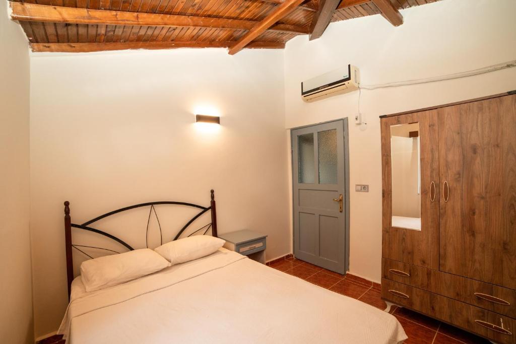 Postel nebo postele na pokoji v ubytování Yakamoz Hotel Gökçeada