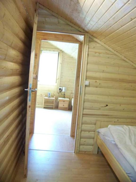Postel nebo postele na pokoji v ubytování Pod Szklaną Wydmą