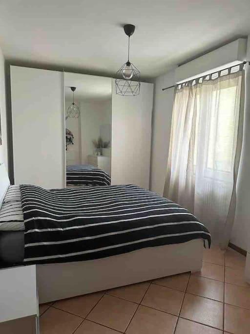 Postel nebo postele na pokoji v ubytování Indomabile Home Como