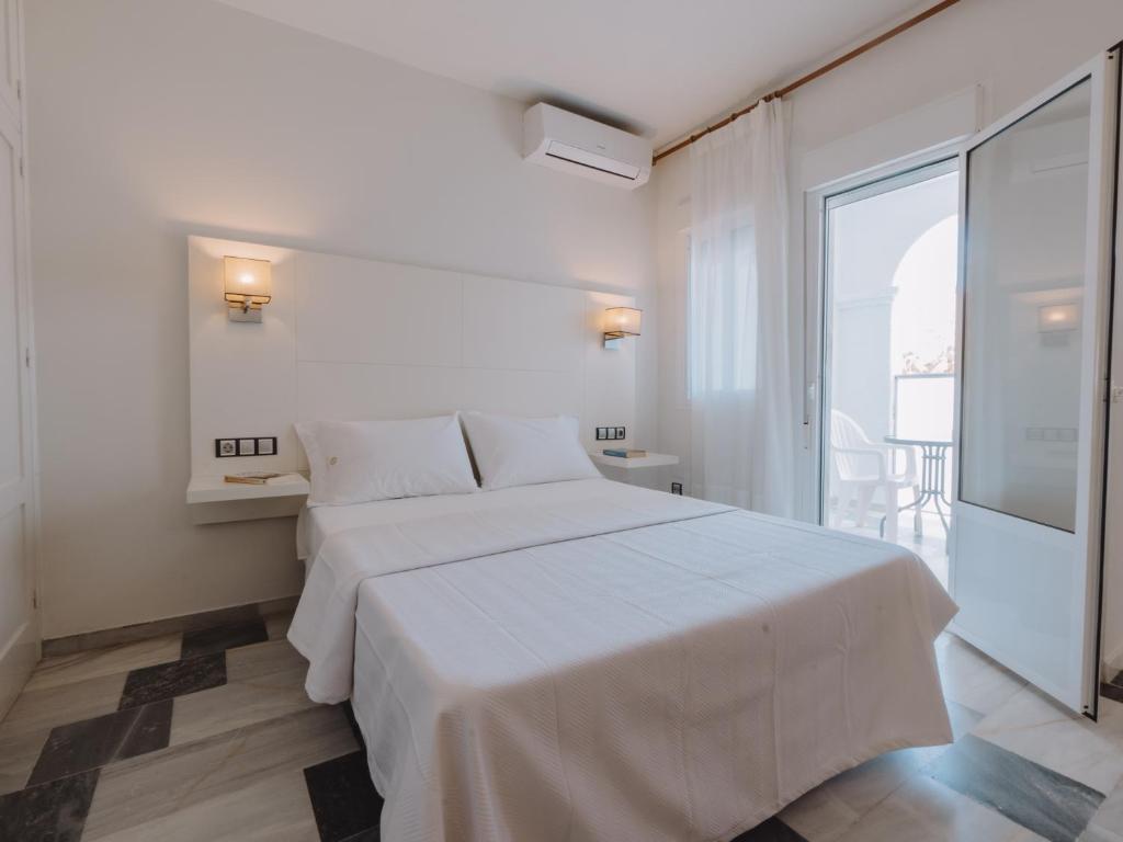 Posteľ alebo postele v izbe v ubytovaní Hostal Las Gaviotas del Cabo